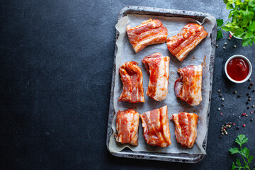 pork ribs raw marinated barbecue sauce grill ready to cook and eat on the table for healthy meal snack outdoor top view copy space for text food background rustic image