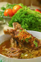 delicious beef rib soup in a white bowl