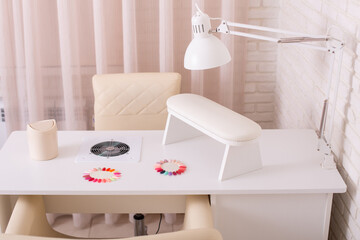 Working place for nail care master in beauty salon. Modern design and interior.
