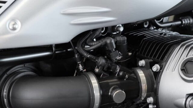 New motorcycle black and silver engine details. Closeup cinematic 4k shot