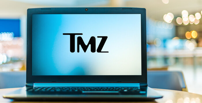 Laptop computer displaying logo of TMZ