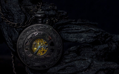 Fototapeta na wymiar Pocket watch on a dark background