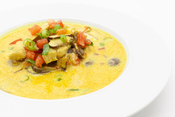 Low carb Curry soup with chicken, coconut milk, champignons, and chilli pepper.