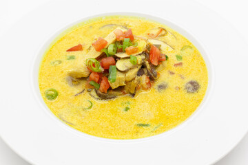 Low carb Curry soup with chicken, coconut milk, champignons, and chilli pepper.