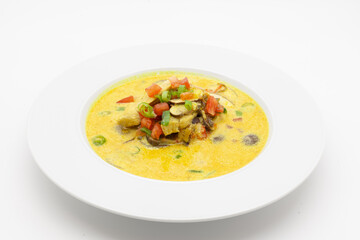 Low carb Curry soup with chicken, coconut milk, champignons, and chilli pepper.