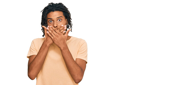 Young african american man wearing casual clothes shocked covering mouth with hands for mistake. secret concept.
