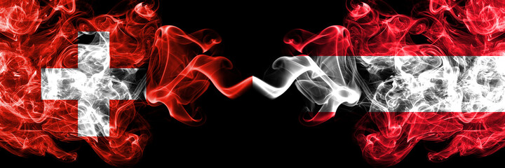 Switzerland, Swiss vs Austria, Austrian smoky mystic flags placed side by side. Thick colored silky abstract smoke flags.