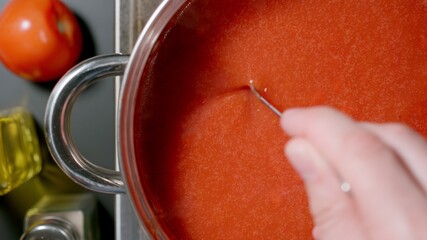 Stirring Rich Red Tomato Sauce While Cooking In A Saucepan, Top view