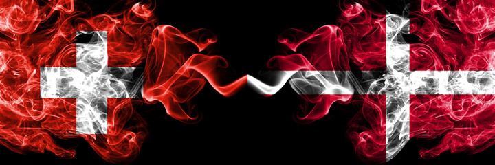 Switzerland, Swiss vs Denmark, Danish smoky mystic flags placed side by side. Thick colored silky abstract smoke flags.