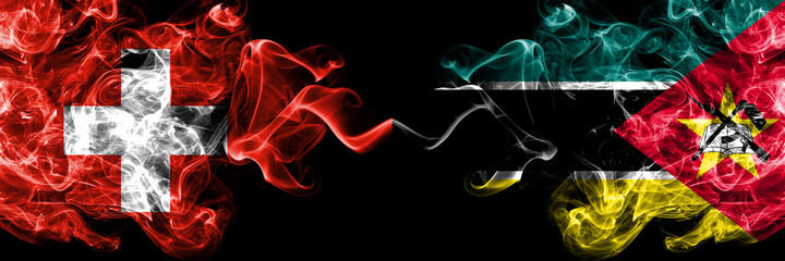 Switzerland, Swiss vs Mozambique, Mozambican smoky mystic flags placed side by side. Thick colored silky abstract smoke flags.