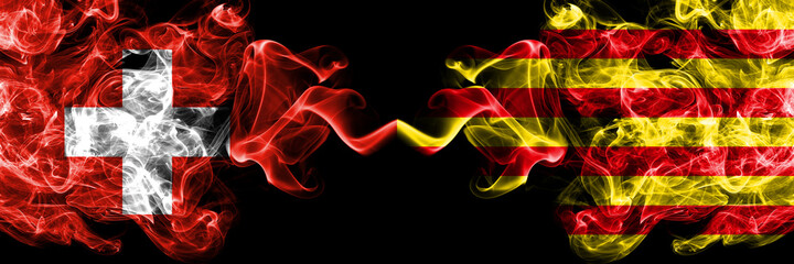 Switzerland, Swiss vs Spain, Spanish, Catalonia, Senyera smoky mystic flags placed side by side. Thick colored silky abstract smoke flags.