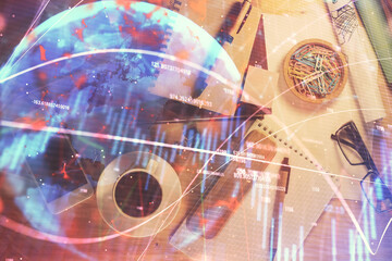 Double exposure of forex graph drawing and work table top veiw. Concept of financial analysis.