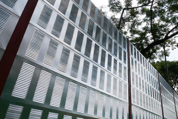 SELANGOR, MALAYSIA - JULY 2, 2020: Noise barriers are installed along the vehicle lane bordering...