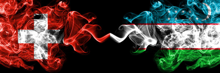 Switzerland, Swiss vs Uzbekistan smoky mystic flags placed side by side. Thick colored silky abstract smoke flags.