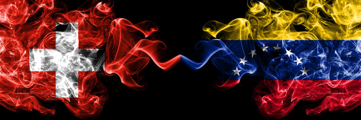 Switzerland, Swiss vs Venezuela smoky mystic flags placed side by side. Thick colored silky abstract smoke flags.