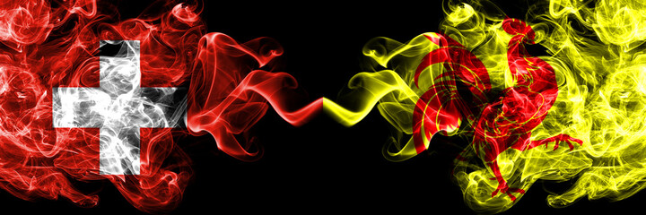 Switzerland, Swiss vs Wallonia smoky mystic flags placed side by side. Thick colored silky abstract smoke flags.