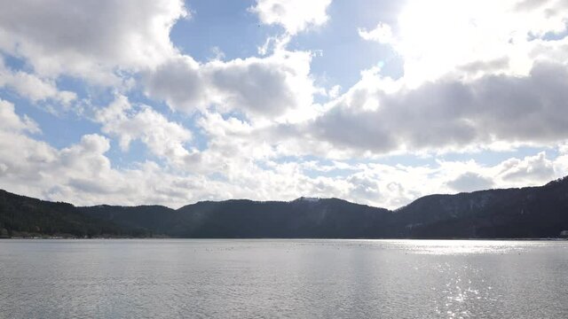 Nagahama, Shiga Prefecture, on a clear winter day, with blue sky and Lake Yogo shrouded in clouds.