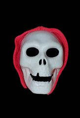 a halloween skull mask on a black background