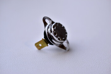 Electronic radio element on a white background thermoelement