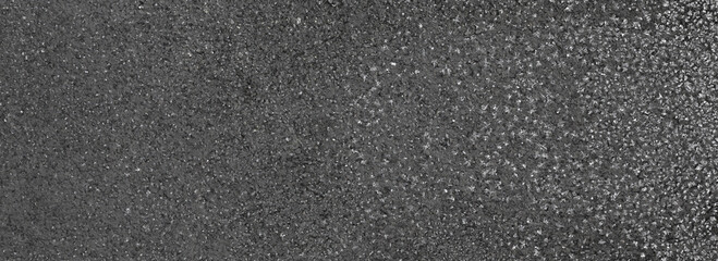 frost on the black asphalt background