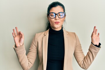 Young hispanic woman wearing business style and glasses relax and smiling with eyes closed doing...