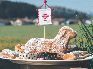 lamb shaped sweet easter pastry with powdered sugar