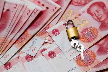 Lock on the background of banknotes. Currency of the China - One red hundred renminbi or yuan notes