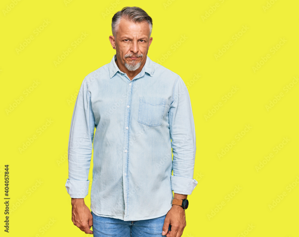 Poster Middle age grey-haired man wearing casual clothes skeptic and nervous, frowning upset because of problem. negative person.