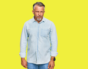 Fototapeta premium Middle age grey-haired man wearing casual clothes skeptic and nervous, frowning upset because of problem. negative person.