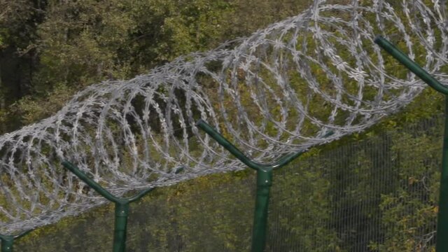 barbed wire fence at the state border