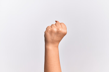 Obraz premium Hand of caucasian young woman doing protest and revolution gesture, fist expressing force and power
