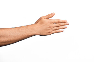 Hand of caucasian young man showing fingers over isolated white background stretching and reaching with open hand for handshake, showing back of the hand