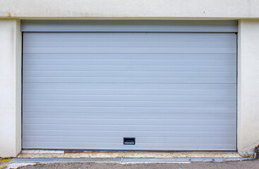 Fototapeta na wymiar Plastic white garage door - exterior