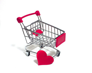 A small trolley on a white background with a red heart
