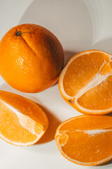 Whole and sliced orange on a background