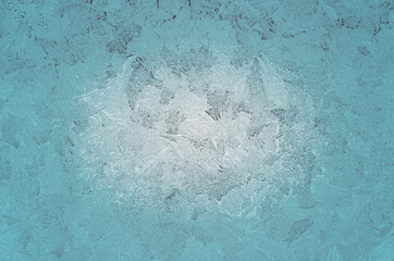 Icy frosty pattern on a window.Christmas winter background.Abstract rime texture.