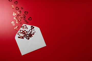 Envelope with hearts on a red background