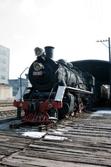 A Steam train on a railroad track