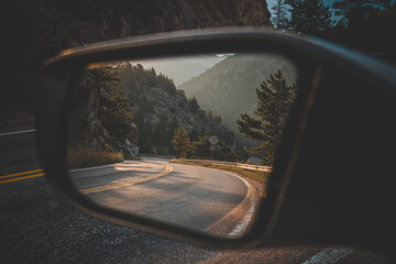 Mirror view of uphill road in the Rocky Mountains