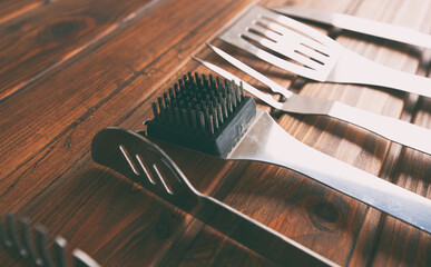 The bbq equipment on the wooden table