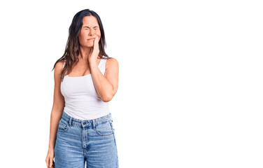 Young beautiful brunette woman wearing casual sleeveless t-shirt touching mouth with hand with painful expression because of toothache or dental illness on teeth. dentist
