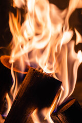 fire of wood logs with flame and heat for winter roasted on an iron grill córdoba argentina