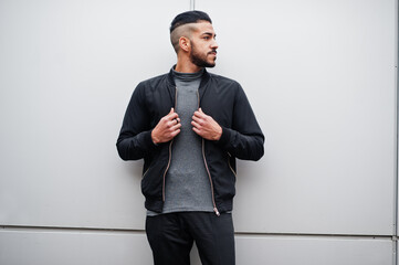 Portrait of stylish arab beard man wear grey turtleneck and black jaket. Arabian model guy against...