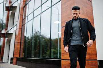 Portrait of stylish arab beard man wear grey turtleneck and black jaket. Arabian model guy.