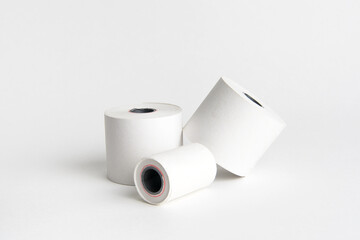 Three rolls of white paper on white background