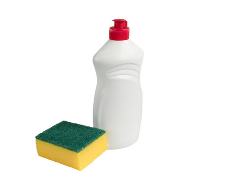 White bottle with dishwashing liquid in a plastic bottle and yellow sponge made of paralon isolated on white background. Detergent for the kitchen. Household chemicals. Foreground. copy space.