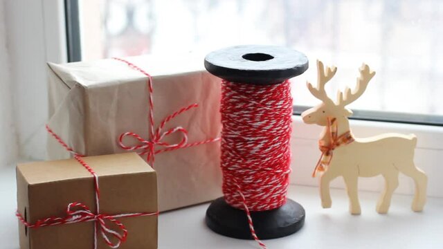 Christmas decorations. Winter composition. Wrapped gifts in kraft paper