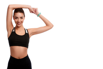 Fit strong sportswoman stretching hands on white isolated background. Fitness female doing physical exercise and smile. Healthcare and weight loss concept