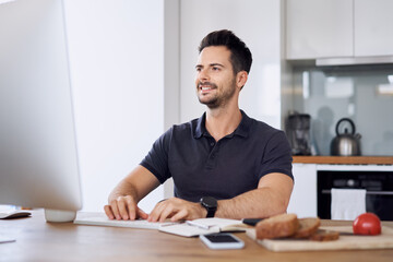 Casual man working from home using computer