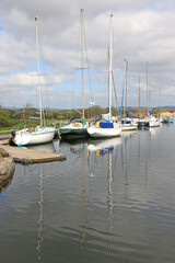 Fototapeta na wymiar Yachts moored on the Exeter Canal, Devon 